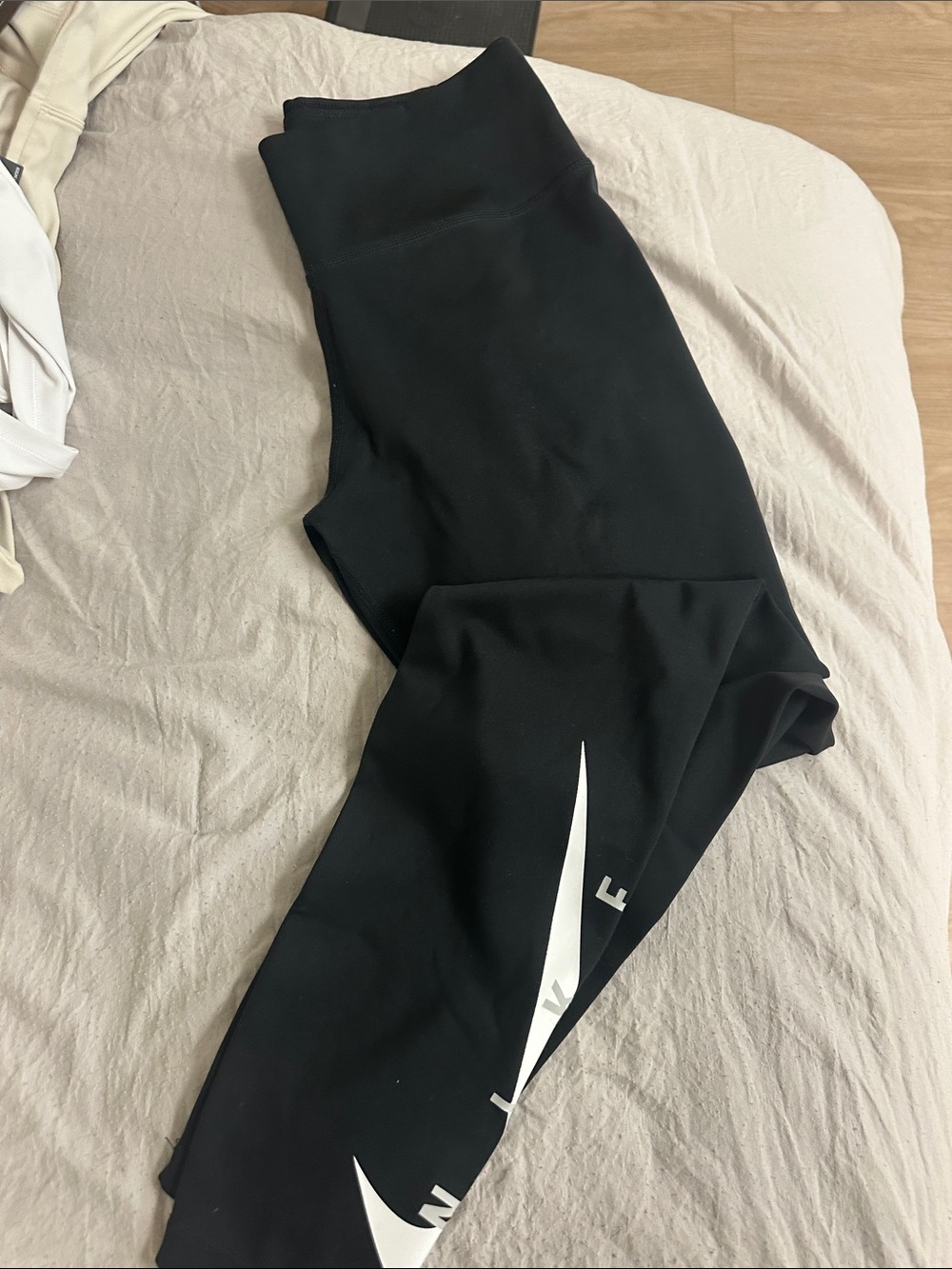 Nike Black Leggings with White Swoosh Accent
